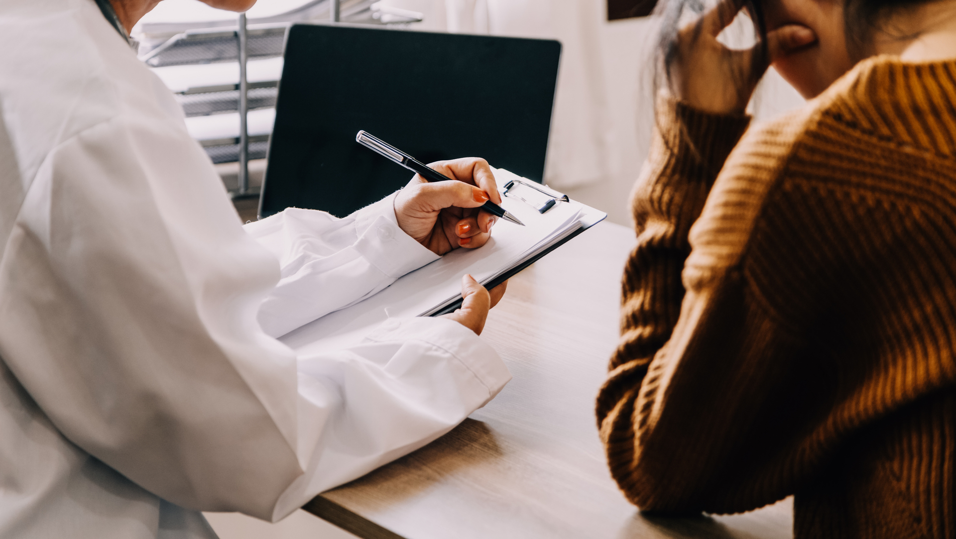 woman talking to doctor