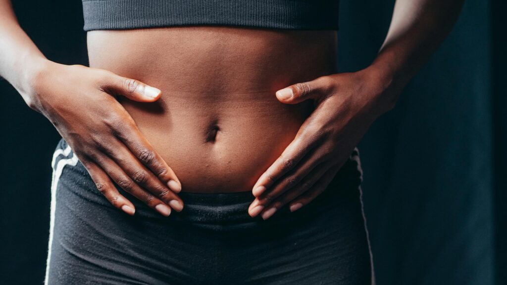 woman holding stomach