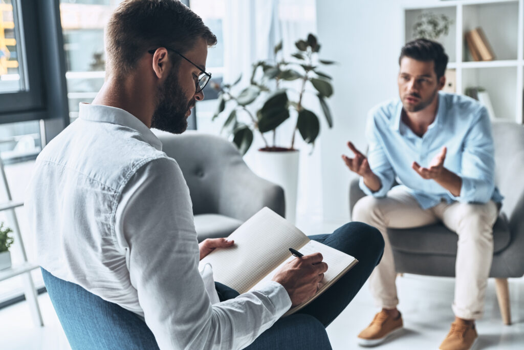man talking to therapist