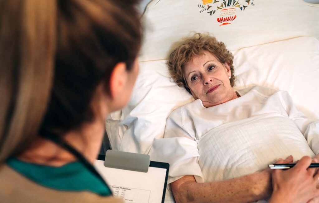 female patient in hospital bed