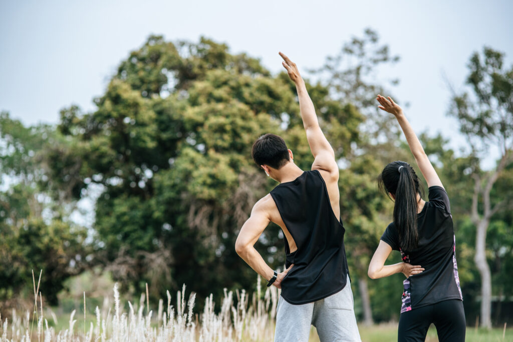 man and woman stretching